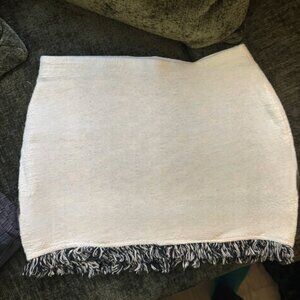 Like new mini white skirt with fringe detail